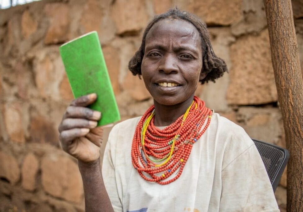 Toke Anewoyacash and Loborose Borokou, cash beneficaries waits at a bank to withdraw money in Dassanch Woreda, South Omo, SNNPR, Ethiopia.
